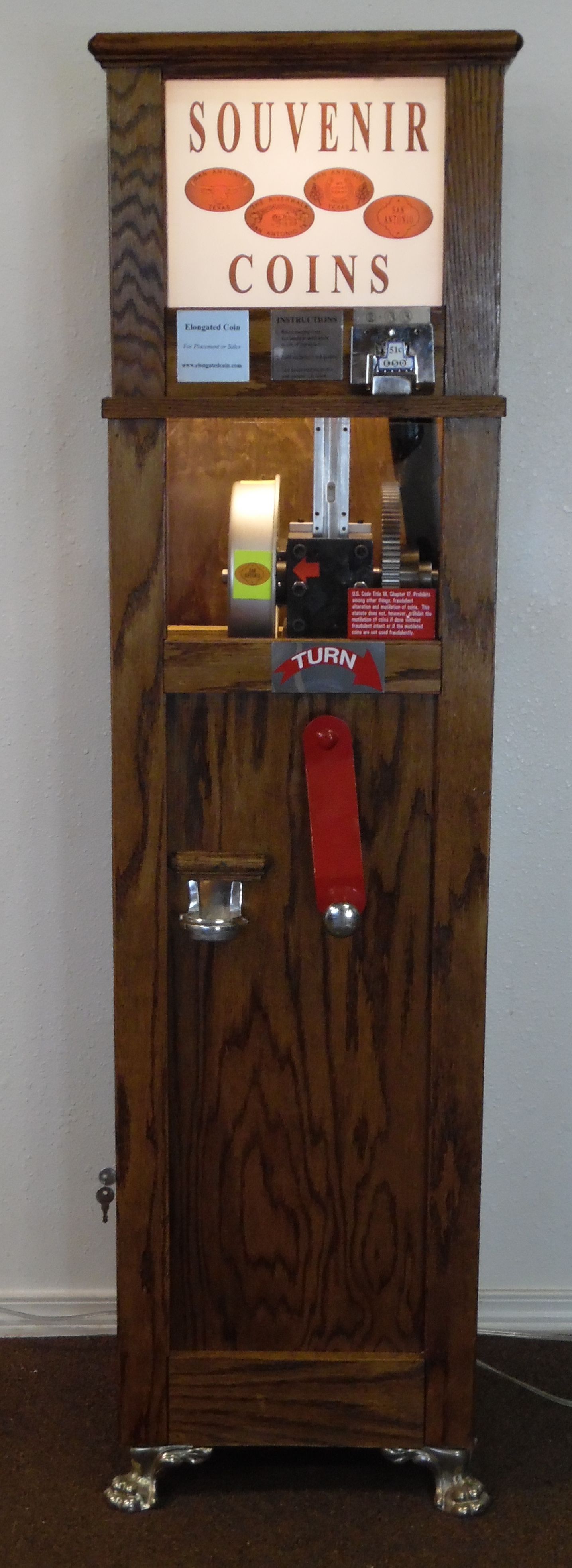 Coin operated penny press